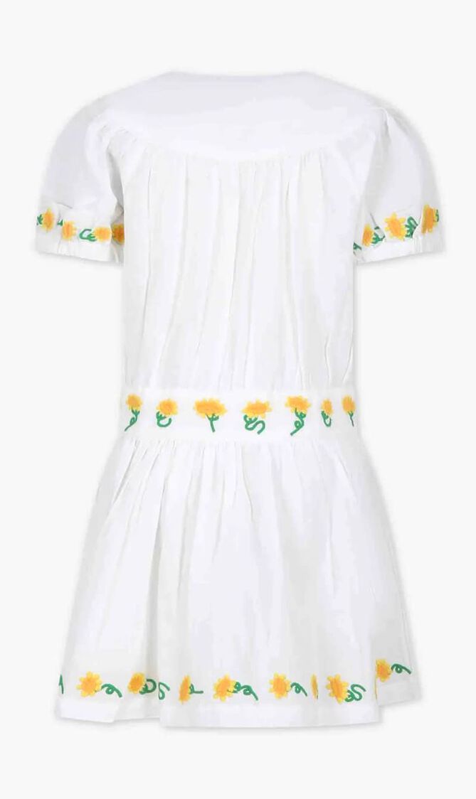 White dress for girl with embroidered sunflowers