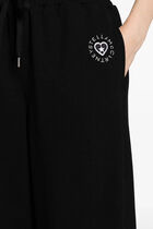 Sporty trousers with logo appliqu&eacute;