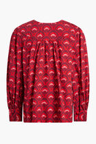 RED TOP WITH PURPLE AND PINK MOTIF AND LONG SLEEVES