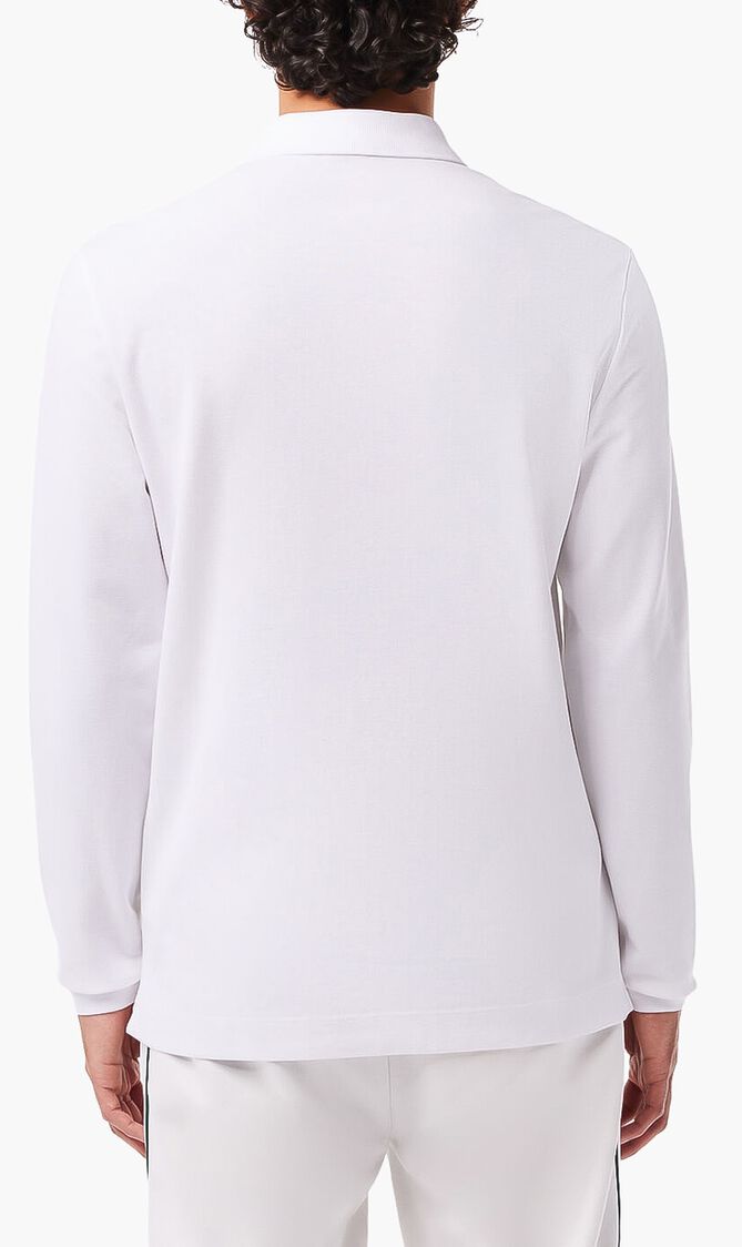 قميص بولو من نسيج مرن ذو قصة كلاسيكية وأكمام طويلة قميص بولو من نسيج مرن ذو قصة كلاسيكية وأكمام طويلة