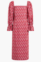 LONG RED DRESS WITH DARK RED FEATHER MOTIF. PUFFED MID-LENGHT SLEEVES AND SQUARE COLLAR.